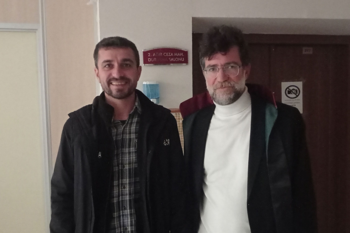 Journalist Ahmet Kanbal and his lawyer